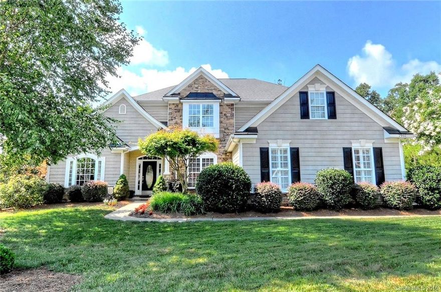 Beautiful transitional styled, stone front 2-story. Light-filled, open floorplan completely updated with brushed nickel hardware, lighting, painted cabinetry, granite counters, backsplash, and modern, neutral paint colors. Upgrades include hardwoods or tile on entire first floor, heavy molding package with crown in every room, 9' ceilings first AND second floor, iron balusters, tray ceilings in dining and master, huge 20' bonus/game room. Private yard w/large paver patio and mature landscaping.