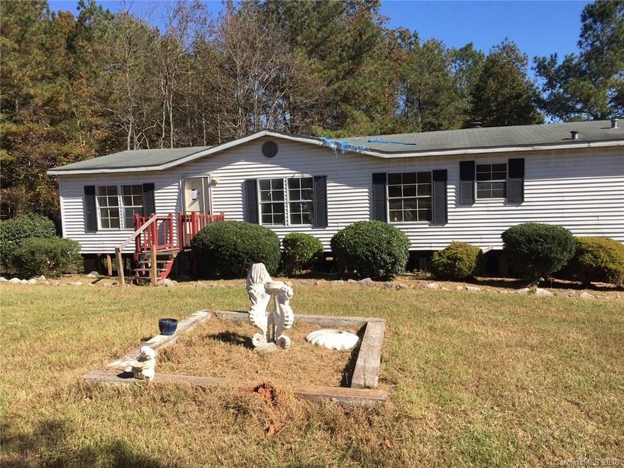 Manufactured home located in the country on over an half of acre lot.