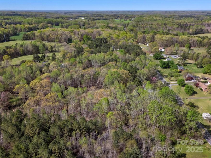 Ready to build your dream home? This private 6.04 Acres is located in the highly sought after Clover, SC area! Just minutes away from thriving downtown Main Street, dining, shopping, parks and schools!  Also centrally located with quick access to Lake Wylie, York, Rock Hill, Fort Mill, Blacksburg, Gastonia and Charlotte!  This gorgeous lot is peppered with mature hardwoods and includes a natural spring!  Bring your own builder or ask us about ours!  Zoned AGC which offers many possibilities for land use and structure types!  No HOA's or CC&R's and no minimum square feet to build!  All in the award winning Clover School District!  Hurry home and settle in on this beautiful tract located in Clover's quaint countryside!