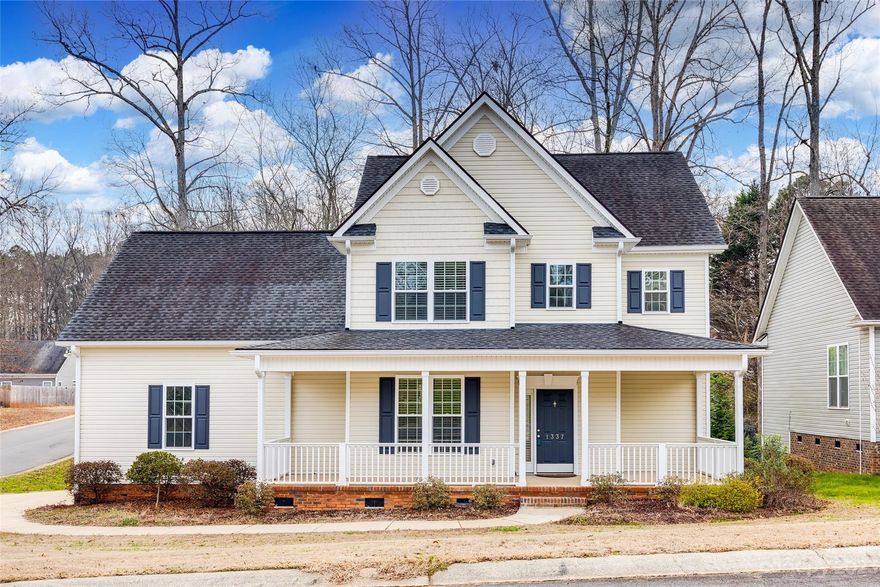 This single-owner, contemporary-style home in the Ashley Park neighborhood boasts three bedrooms, two and a half baths, and features soaring ceilings in the great room, offering a spacious and airy atmosphere. Its proximity to downtown Rock Hill makes it convenient while still nestled in a serene setting with a wooded backyard and a calming backyard stream. The kitchen showcases contemporary cabinets and a stylish backsplash, complementing the modern design. With the primary bedroom conveniently located on the main floor, the home offers both practicality and comfort. Additionally, the expansive rocking chair front porch provides a charming space to enjoy the surroundings.