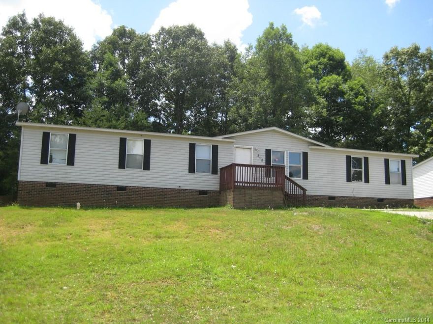 Double-wide manufactured home, large lot, great price! Tax value is approximately $70,000.