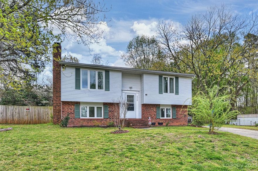 Located on a private cul-de-sac lot within walking distance to Piney Grove Elementary School & the Greenway and easily accessible to Uptown, Matthews & more! This beautiful two story home encompasses over 1,600 square feet with 3 bedrooms, 2 full bathrooms, open kitchen & living room space on the upper level plus an additional family room space with fireplace on the lower level. Updated floors on both the upper & lower levels, newer windows & fresh paint throughout. Exterior features a carport, fully fenced, private .4 acre lot with above ground pool & outdoor spaces perfect for dining, relaxation & entertaining to enjoy for all four seasons.