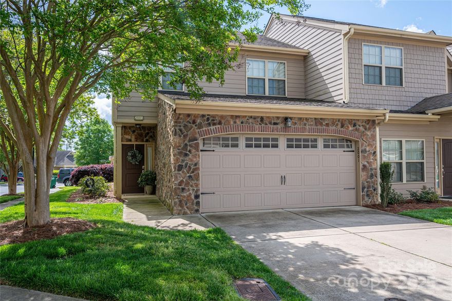 JUST LISTED! MAKE YOUR APPOINTMENT TODAY to see this move-in-ready townhome featuring beautiful stone finishes on the exterior, an open floorplan, gleaming granite counters, upgraded light and plumbing fixtures, spacious kitchen island, Frigidaire Gallery kitchen appliances, large bedrooms, comfort-level bathroom countertops and toilets, and a tiled primary shower with walk-in closet! Numerous upgrades have been installed since homeowners purchased including new sliding patio doors, neutral carpet and paint, some new light fixtures, closet systems, stacked washer and dryer, and a smart thermostat (2-zone with Bluetooth)! Relax on your private rear patio with paver stones and an adjustable-shade pergola with retractable screens!  Don't miss the adorable, patio strawberry garden hedged with fragrant lavender and rosemary plants!  Neighborhood features include an inground community pool, clubhouse, and fitness center (just a short stroll away)!