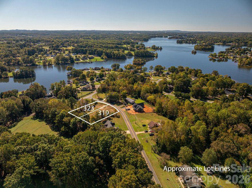Rare opportunity to purchase TWO side-by-side lots at 319 & 323 Harbor View Drive! Offered together for added space, privacy, and flexibility, these parcels create an ideal setting for a larger homesite, multi-generational living, or future investment/building. The property also offers seasonal lake views, adding to the natural beauty of the setting. Both lots have been cleared and ready for your plans, and each parcel has been perked for a 4-bedroom home, providing an excellent opportunity. County water is available, making development even more convenient. Whether you’re looking to build your dream home with additional land, create two homesites, or invest in property with future potential, purchasing both parcels together offers a unique advantage. 
These properties present a great opportunity for homeowners, builders, or investors alike. Opportunities to purchase adjoining lots together with seasonal lake views w/ no HOA are increasingly rare—don’t miss your chance to secure these two amazing lots in Harbor View!