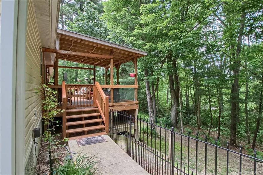 This very nicely upgraded and well maintained home is on a wooded lot convenient to Pisgah and Dupont Forests, Hendersonville, and Brevard. All new laminate floors, lighting, upgraded kitchen with gas stove and quality appliances including a side-by-side Fridge, gas stove. $14000+ in concrete Drives & sidewalks, Bring your boat or RV. Gas fireplace in an open floor plan. Lots of Covered and Open Deck space and yard potential.  for enjoying the cool mountain evenings. Must See to Appreciate!