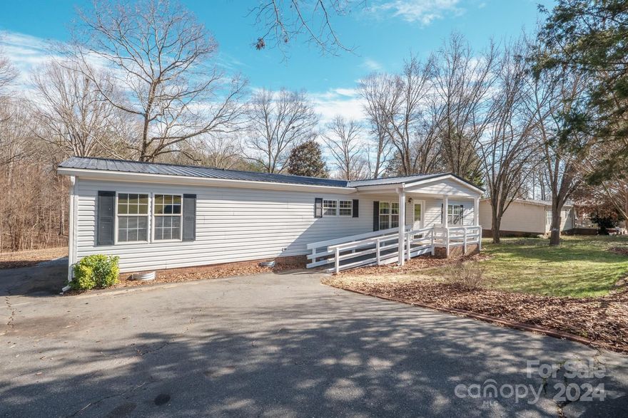 Back on the market!  This lovely home in Rowan County, sitting on over 1 ½ acres is exactly what you need. With 3 bedrooms and 2 baths in a spacious open layout, it's the perfect fit. Recent updates include a new metal roof, fresh paint throughout, and LVP flooring. The large kitchen is a standout, boasting new appliances, granite countertops in both the kitchen and bathrooms, and an abundance of cabinet space to cater to all your storage needs. Primary bathroom features a large walk-in shower. Imagine the joy of entertaining or simply unwinding on the expansive covered back deck while soaking in the scenic view.