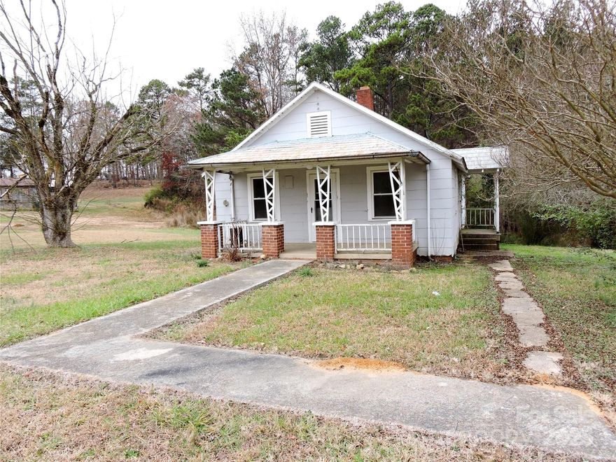 This home and workshop are in the Pee Dee Community in Montgomery County. There are two parcels being sold together with a total of 4.15 acres. The second parcel is PIN 6595-00-05-8848 which has a workshop ( previously a cabinet shop ) with 2160 hsf, 684 unheated sf in the basement and a 3 bay equipment shed. There is a drive in garage door to the shop area and a half bath. There is a spray booth in the shop as well. The home has potential with some work to the property. The storage building behind the workshop does not convey with the purchase. The properties are being " Sold As Is ".