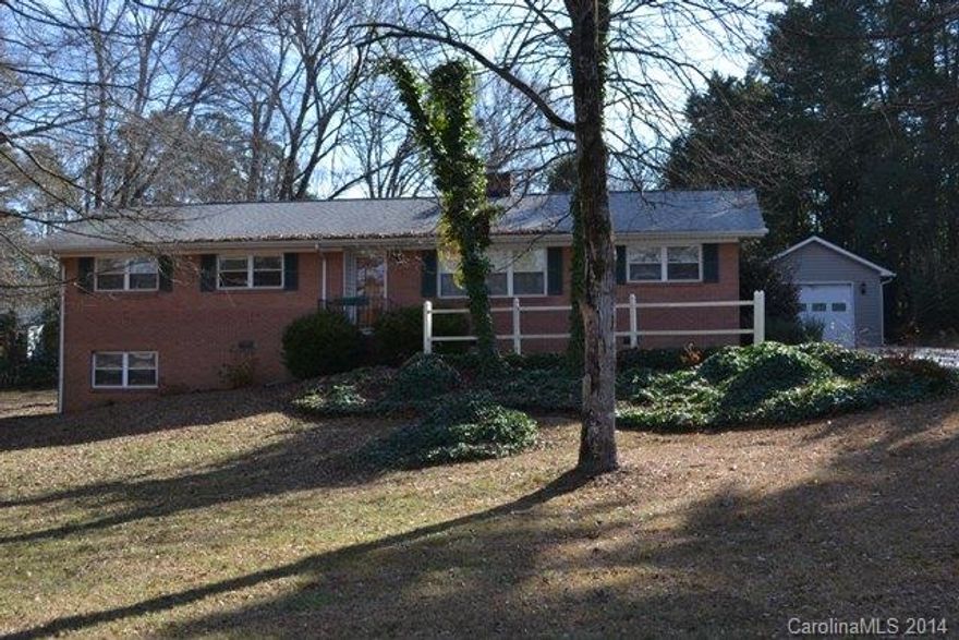 What a dollhouse!  This mostly brick home offers a large lot and awesome view of the neighborhood lake.  Hardwood floors throughout living area and bedrooms, tile in baths and kitchen.  HUGE screen porch, detached garage.  Walk-in crawl space.  Great location with awesome interstate access, convenient to schools, shopping and restaurants.  HOA is voluntary for homeowners to join.