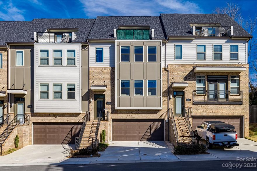 Explore this stunning townhouse featuring numerous upgrades. Positioned at the end of the street, it boasts access to green space behind it, a rarity in the community. Spacious living areas, abundant storage, and outdoor privacy make this residence perfect for your needs. Each bedroom comes with its own en-suite bathroom, complemented by a powder room on the main living floor. The gourmet kitchen stands out with 42" cabinets, quartz countertops, and upgraded hardware. Designer lighting and ceiling fans throughout the home. Wide plank flooring on the main living areas and stairs. Custom accent walls elevate the aesthetics on every floor. Don't miss the city skyline view from the top floor terrace– a spectacle to enjoy with friends throughout the year!