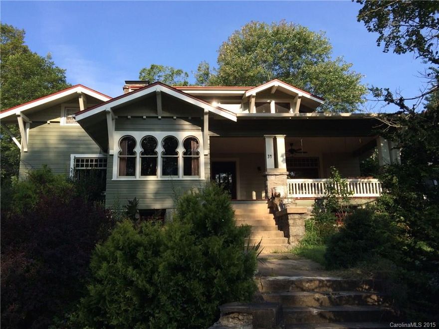 Own one of Montford's gems!  The Keyhole House, known for it's Asian-flared Arts & Crafts style and keyhole shaped windows. Currently configured as a tri-plex with two apartments upstairs with separate entrance, this home could easily be converted back to single family.  Downstairs features original craftsman built-ins and wood columns with original finish.  Many original light fixtures including hammer metal chandelier in dining room and a custom curved radiator.Wonderful windows throughout.