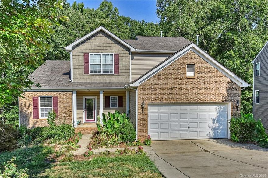 Tons of potential in this 2 story, with walkout unfinished basement.  Enjoy watching the wildlife from the partially covered extended deck...overlooks hard to find private woods.  Roomy master suite on main with tile surround jacuzzi tub, dual sinks!  Upgraded kitchen w/granite, SS touch faucet, refrigerator included.  Nice hardwoods on main except in master.  Upstairs offers two additional bedrooms and loft area perfect for flex space.  Close to shopping, Clover schools!  Home warranty offered!