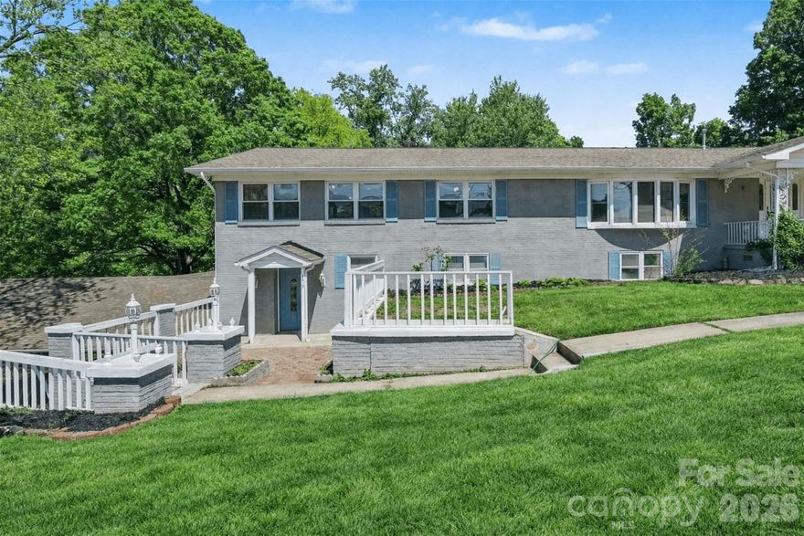 This exceptional 6,000 sq ft property offers a rare and versatile opportunity with three fully independent living spaces within one expansive home, all set on a private 1-acre lot. The home features a timeless exterior with elevated decks and multiple entrances, enhancing both functionality and flexibility.

The main level (3 beds/2 baths) lives like a complete residence, showcasing bright, open living, dining, and kitchen areas filled with natural light from large windows. A four-season porch provides additional year-round living space with scenic views. While most of the home has been updated, the primary bath offers an opportunity for customization.

The lower level expands the possibilities with two separate living quarters, each with private entrances, kitchens, living areas, bedrooms, and laundry. One unit is more spacious (3 beds/2 baths), while the other is a well-appointed, more compact option—ideal for extended family, guests, or rental income.

Recent updates include three new HVAC units, a tankless water heater, fresh interior and exterior paint, updated kitchens and bathrooms, and new flooring throughout. Bright finishes and a clean, modern aesthetic create a move-in ready feel across all spaces.

Outdoor areas offer privacy and room to relax, while the convenient location provides easy access to shopping, dining, and major roadways—combining everyday convenience with a peaceful residential setting.

Adjacent land owned by the sellers and can be sold with the property.