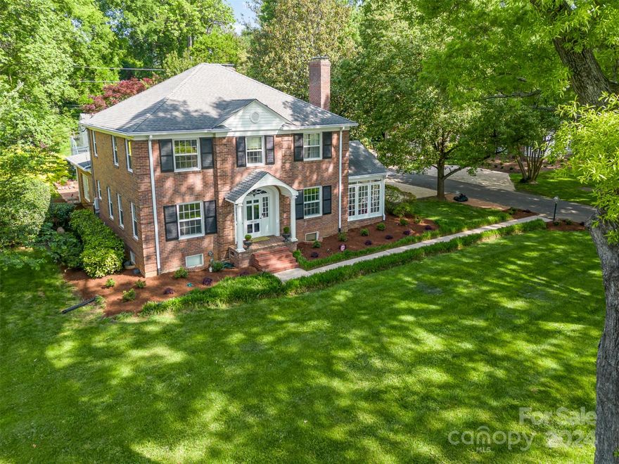 Welcome home to this classic Myers Park all brick two-story Georgian style home on a beautiful .71 acre lot. The home's vintage characteristics- 9ft ceilings, gorgeous millwork, hardwood floors on main and upper floors, and multiple fireplaces- blend seamlessly with modern day updates to kitchen and baths. The primary BR, updated in 2018, includes 2 walk in closets; the ensuite bath showcases double vanities, a walk in shower and free standing tub. The upstairs full bath and the main level half bath were also updated in 2018. A full bath and BR (no egress windows) in the basement make for ideal guest quarters and the basement den with fireplace is a cozy hangout. Cap off summer evenings on the back patio with a masonry fireplace. Fresh new landscaping, incl new pea gravel parking pad and paver walkup to side porch! Crawl space and basement utility rms are waterproofed and sealed. Freshly painted, newly tiled fireplace surrounds, new gas cooktop, updated lighting, fully fenced backyard.