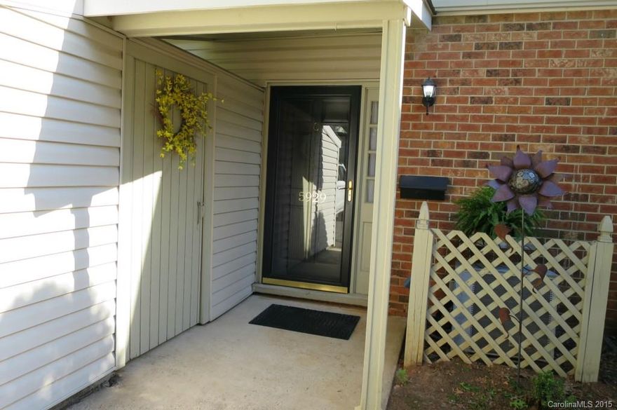 Lovely updated 3 BR condo backs to trees w private patio & lots of storage. New roof 2014. All windows have been replaced.  Bathrooms updated w new vanities w granite tops.  Master Bath has new shower glass doors.  Hardwoods in LR & DR.  Eat in Kitchen w tile floors & tile backsplash, granite, desk area, ss appliances. Separate laundry rm!  Half bath on main w pretty tile floor, beadboard, pedestal sink w new hardware. Extras include crown molding, great light fixtures, wide stairs & location!