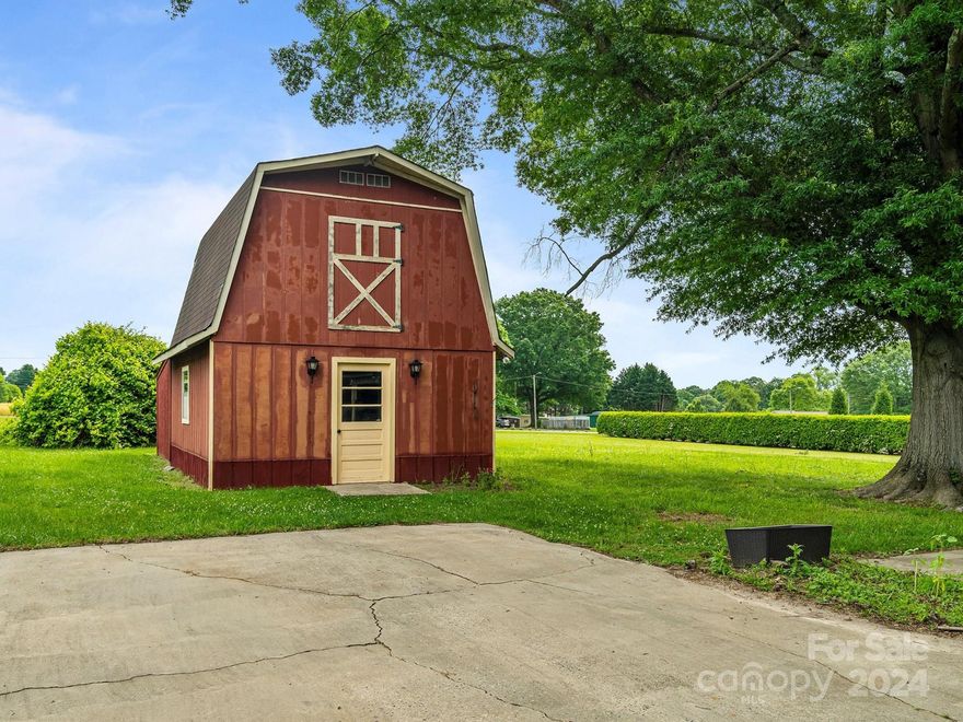 Beautiful Brick Ranch Home on a Stunning almost ½ acre Lot. Enormous Living Room with Stunning Brick Fireplace & Beautiful Floors. Large Kitchen with Breakfast Bar leading into the Large Dining Room. Large Primary Bedroom with Updated Half Primary Bathroom. 2 more Large Bedrooms and another Updated Full Bathroom. Lots of Storage including an unfinished Mudroom & Storage Room. Plus a Huge 2 Story Barn with additional Back storage totaling over 800 sq ft. Stunning Flat Backyard with Large Patio, Carport or Covered Patio, Level Grass Backyard and a Beautiful Large Tree.