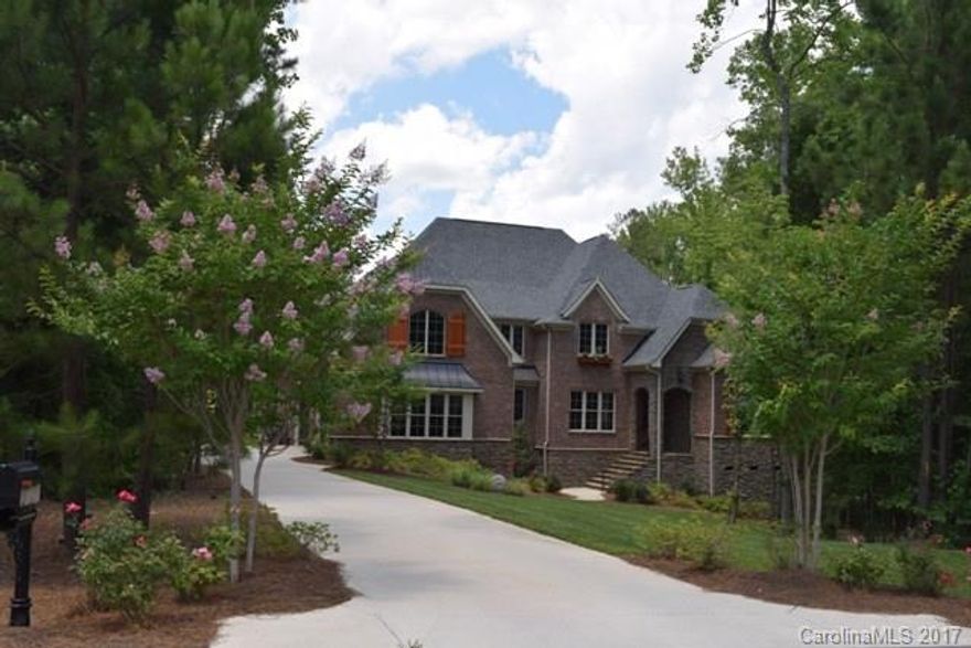 Gorgeous home with tons of upgrades offers luxury living at its best! Outdoor living space includes large screen porch with a fireplace, salt water inground pool and hot tub, outdoor shower and half bath, fenced back yard. Hardwood and tile flooring throughout entire home. Gourmet kitchen has stainless appliances with gas cook top, large breakfast bar. Beautiful coffered ceiling in great room. Master and guest bedroom on main. Huge bonus and additional bedrooms up with a great workstation.