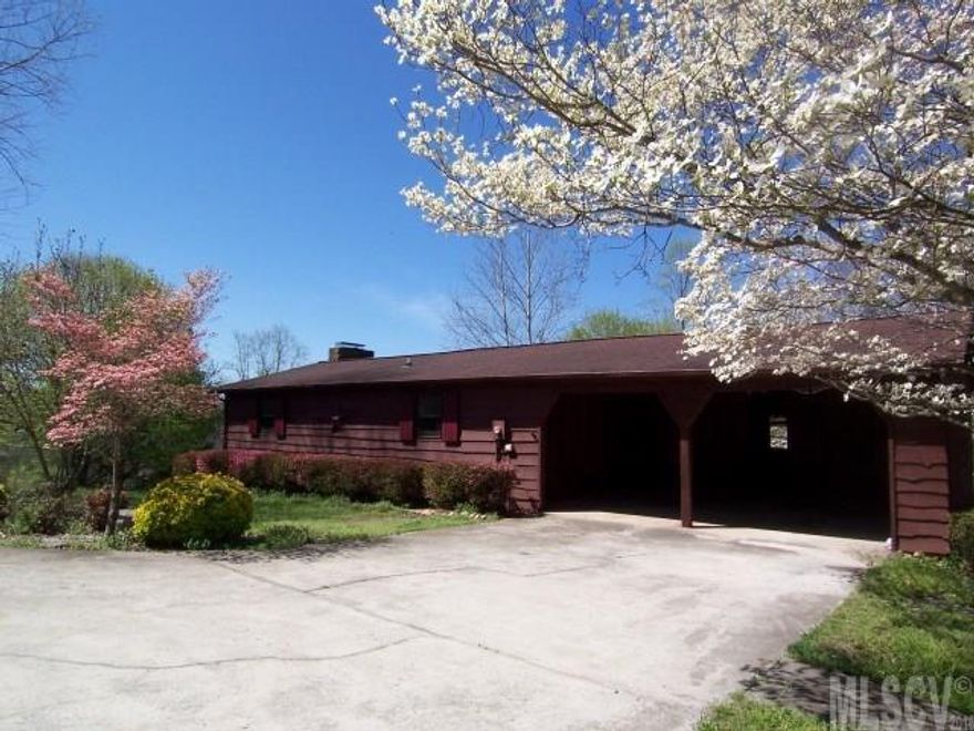 A RARE FIND - HERE'S A QUIET, SECLUDED SETTING BOASTING COUNTRY CABIN W/LOVELY LONG-RANGE MTN VIEWS, RIGHT IN YOUR PRICE RANGE! 2.74 Acres is nestled at the end of this little lane & perched atop a knoll creating this private niche! A lengthy deck & screened porch are perfectly placed to savor the tranquilizing spectacle beyond!  Newly stained wavy mtn siding greets you & is complimented by a cozy charm throughout the home w/a beamed vaulted ceiling, wood window shutters, gas logs & 2 of the 4BRs on the main . The basement boasts another full kitchen & den along with the other 2 BRs & 2nd full BA; this area is easily a separate living space with access through the glassed porch! Plenty of space for your outdoor needs can be found off the enclosed carport  & in a small building w/matching siding. The pool was in perfect working order last season & has been laying in wait for the new season to warm! I know you'll agree, it won't last long, so COME CALL THIS ONE HOME, WHILE YOU STILL CAN!