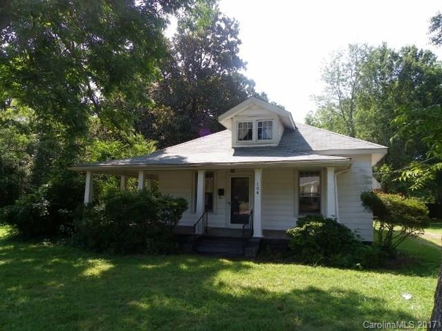 Cute ranch in walking distance to quaint downtown York! Roomy kitchen, pretty wrap around porch, lots of potential. New roof. Level lot with mature trees.
