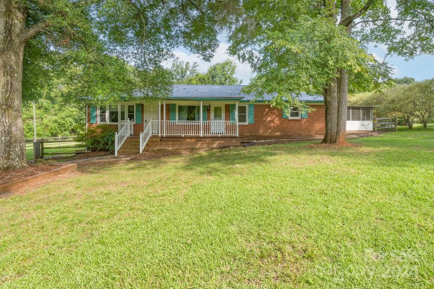 Welcome Home! This full brick 4BD/2BA ranch home is on the market! Enjoy close to an acre of peaceful country living with a spacious porch and beautiful wooded lot. NEW Carpet will be installed on 9/25th!  Kitchen has 42in cabinetry and granite countertops.This open floor plan home offers hardwoods throughout and freshly painted walls. Newer HVAC and metal roof. This home is turn key and ready for you! NO HOA! Easy commute to shopping, 77 and Charlotte.