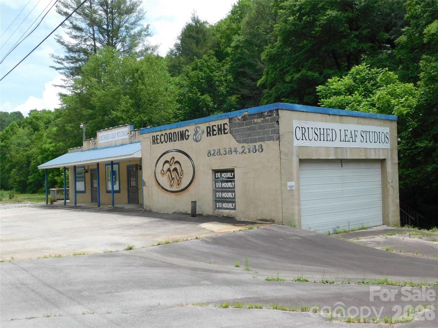 Prime commercial/mixed-use opportunity on highly traveled NC 280, just before the Henderson County line. This 4,700+ sq ft property sits across from Turkey Pen Road, the gateway to the popular Turkey Pen Trailhead—well known for hiking, mountain biking, and horseback riding -- making it an ideal location to capture year-round outdoor recreation traffic.

Originally built in 1949 with durable concrete and block construction, the building features a walkout basement and offers multiple possibilities for renovation or adaptive reuse. With approximately 280 feet of road frontage, the property provides excellent visibility and easy access for a variety of ventures.

Perfectly suited for an outfitter shop, café, brewery, vacation rental conversion, equestrian-related business, or multi-tenant investment. The property also borders scenic Boylston Creek, adding to its natural appeal and potential customer draw.

Strategically positioned along the corridor to Pisgah National Forest, this is a rare opportunity to establish a business or investment property in one of Western North Carolina’s most sought-after outdoor destinations.