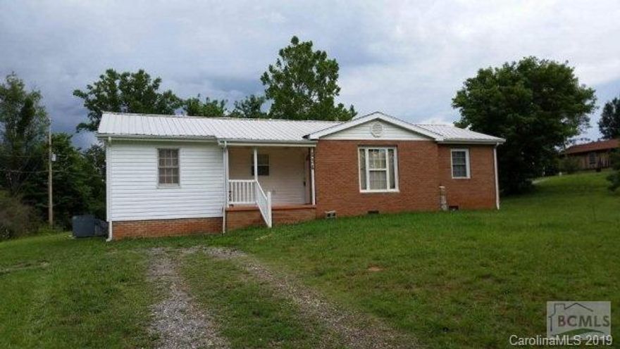 Clean and neat. Move in ready. 3BR/2BA brick ranch. His and her closets in Mst BR. All appliances stay, including dryer. Ceiling fans in all rooms. Nice deck on back, small covered front porch. Oversized heat pump. Outside storage building and outside cooking pit for those family BBQ's. First time home buyers and anyone looking for a home that would pass USDA standards, this is it. New metal roof installed July 2016, Carpets cleaned and outside vinyl has been pressure washed July 2016. New metal Roof.
