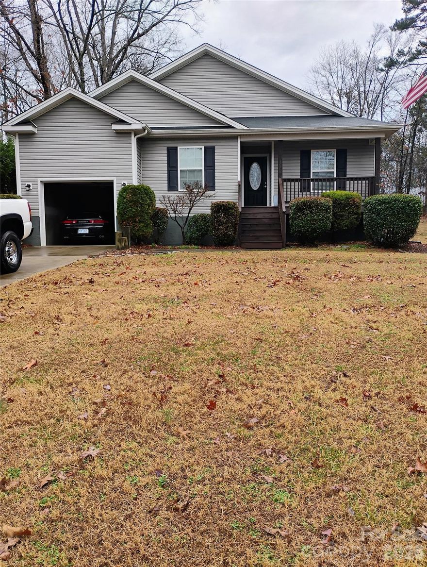 Welcome to this first time on the market home at Lake Norman. .  Located just a short distance out Kiser Island Road in Terrell, a bustling and growing Lake Norman Community. The home has a split floor plan for the bedrooms, a central hallway, and open living room with vaulted ceiling, dining area with chair rail/picture molding and u shaped kitchen.  All of the black appliances are included.  They too are in great condition.    Master bedroom has a trey ceiling, with a private bath and walk in closet.   A single garage provides access to the home via the large laundry room.  No need to spend time cleaning floors, as there are Laminate floors in excellent condition  throughout thus no carpet to clean.   Home is spotless and has had great upkeep, and care.  Lake Norman's Marshall Fishing Area which is open to the public is just a half mile away.  If you're looking for a full time home, or a weekend retreat, look no further.