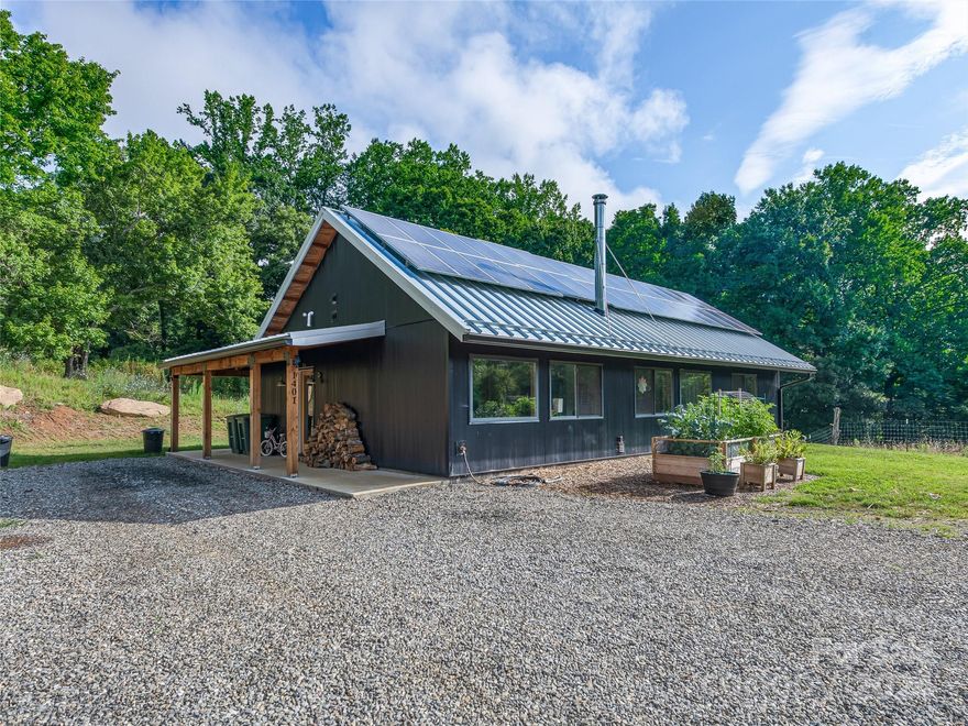 Truly a one-of-a-kind property! Acres of rolling pasture offering Southern/Southeastern orientation with an upper wooded ridge providing privacy and opportunities to explore. Multiple springs & streams, plus roads and trails for easily navigating the land. 2023 off-grid home produces all its own power; post & beam community center for hosting gatherings; multiple farm buildings and other infrastructure throughout the property, including two solar-powered residential capacity wells; and many amazing building sites! Great blend of expansive open areas & private nooks and crannies. This unrestricted parcel offers a wide range of potential uses. Bring your vision! Less than 10 minutes to I-40 & 15 minutes from West Asheville. Additional information provided in attachments. Listing agent is happy to help show. 
Property Video available here: https://iframe.videodelivery.net/5a95c9919cbfc427439bd7c1e4ca58d9
360 Aerial Tour available here: https://tours.singlepointmedia.com/tours/Uksj7H70M