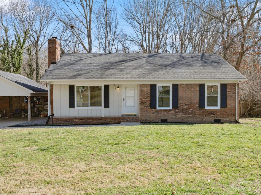 **OFFER DEADLINE - 12PM 2/6**ADORABLE one level home located in the desirable area of Gastonia and on a "no outlet street"! The moment you enter through the front door, you will feel at home. Family room area has great space and a beautiful wood burning fireplace. The kitchen offers a great amount of storage, space for barstools, and an eat-in-kitchen area. Laundry room is located off the kitchen. Primary bedroom has a walk-in closet and a full primary bathroom. Every bedroom has BRAND new carpets and fresh paint. Oversized deck for entertaining. Large carport for storage. Fantastic backyard/lot that is semiprivate with no neighbors to the left and mature trees. HVAC is around 3 years old. Windows are around 2 years old. Welcome HOME!