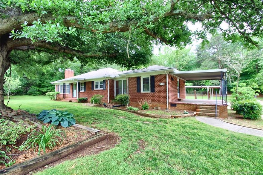 Brick ranch home has the space you've been looking for. 3 bedrooms & 2 full baths with large living room and second den space with ceramic tile floor. Kitchen has updated appliances and countertops. Rinnai tankless water heater.  Covered porch, 2 car carport, fenced backyard, storage building. Just a little cosmetic work and you can make it your own! Seller open to doing improvements with acceptable offer.