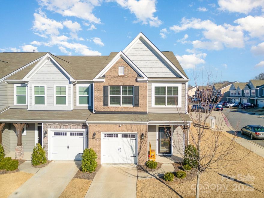 Welcome to this beautifully updated 3-bedroom, 2.5-bath end-unit townhome in a prime Charlotte location! Step inside to find LVP flooring throughout, an open-concept kitchen with quartz countertops, white cabinets, a sleek tiled backsplash, and stainless steel appliances. The living area features shiplap accent wall, modern light fixtures and a ton of natural light! Upstairs, you'll find spacious bedrooms and open loft, perfect for an office, living space or exercise area. The spacious primary bedroom includes a bathroom en-suite with dual vanity sinks and a walk-in shower.  The custom-designed laundry room offers additional shelving and stylish shiplap detailing. Outside, enjoy a screened-in porch overlooking the upgraded low maintenance turf yard, all enclosed by a privacy fence for a peaceful retreat. Enjoy the pool, fitness center, clubhouse AND lawn maintenance. Just minutes to shopping, dining, and major highways, this move-in-ready home is a must-see!