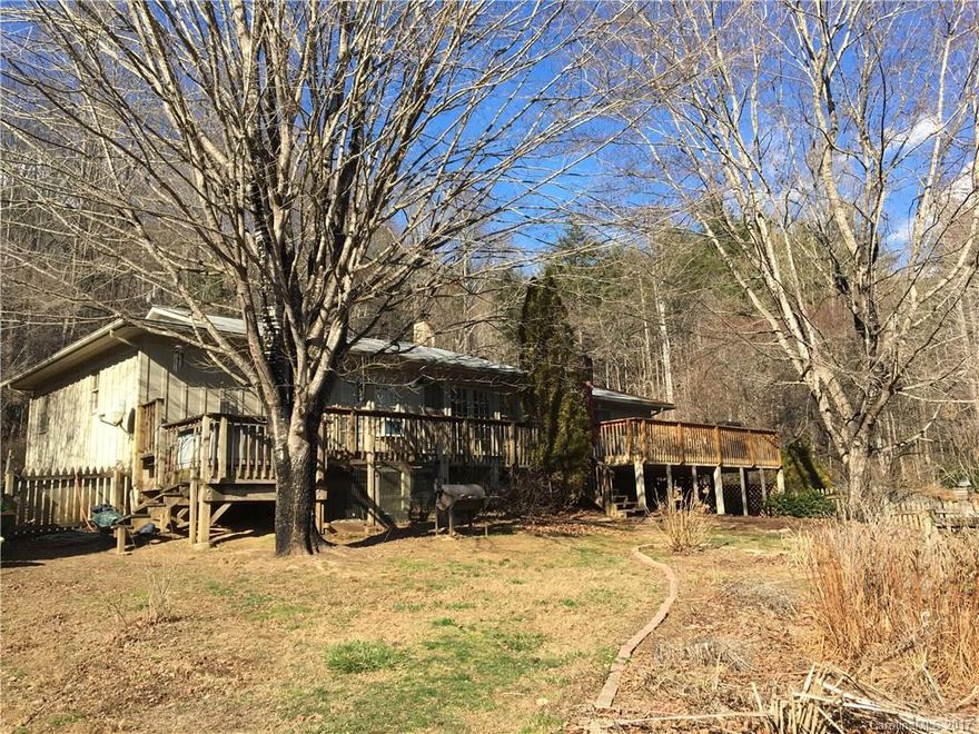 Sylva, NC. Peaceful property with spacious 2/2 house with BONUS ROOM. Bordered on 2 sides by a creek. Private waterfall. Blueberry bushes, grapevines, peach, pear, trees, and an apple orchard! A portion of the property is fenced for animals. House has updated kitchen, new roof, fresh paint, & updated master bedroom with bamboo flooring. 2 wood stoves. Property includes a beautiful 2 story artist studio/guest house with a new tankless gas water heater! Convenient to Sylva and WCU. Priced to sell!