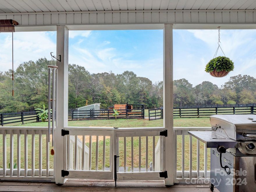 Discover the ultimate in country living! This exquisite ranch-style home features 4 bedrooms and 3 bathrooms, nestled on a sprawling 5-acre lot that beautifully harmonizes comfort and serenity. Step inside to find a move-in ready oasis, where an open floor plan showcases gleaming hardwood floors, an abundance of natural light, and impressive vaulted ceilings that grace the great room, kitchen, dining area, and bedrooms. The spacious kitchen is a chef's dream, equipped with stylish cabinetry, modern stainless steel appliances, and generous counter and storage space. Unwind on the inviting rocking chair porches or enjoy the versatile bonus room above the garage, perfect for extra living space or a home office. This meticulously maintained home is a true gem—don’t miss the chance to make it yours!