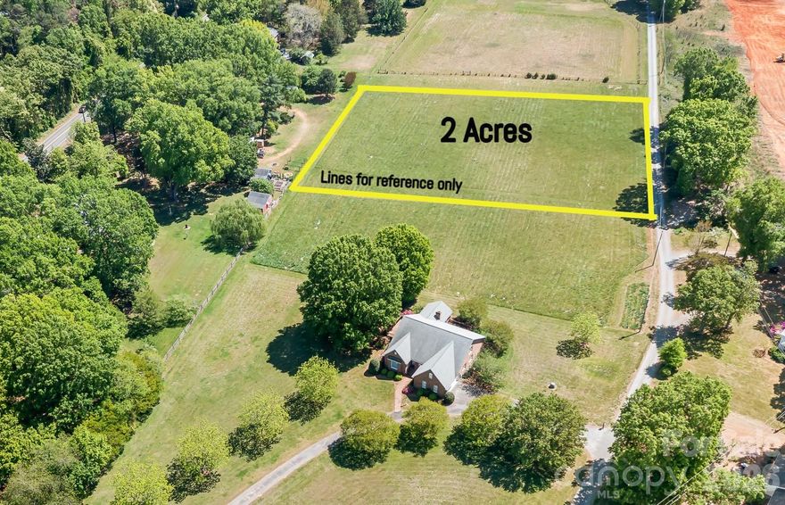 Looking for a level 2 acre lot to build your dream home.  This is it in the heart of Mint Hill, yet a quiet serene atmosphere.  The Lot was created when the family subdivided a larger lot. No discovered restrictions except what the county or town would allow.  We do know that whatever you build first will dictate the size of any additiional buildings. First structure built will be the largest allowed.
Property will need a well and septic.  It is not a public road but an easement off Bain School.

Mecklenburg county has not updated. tax records. It shows the old parcel ID for the large lot that was subdivided that had the home on it. So tax records currently shows value for the house and land.