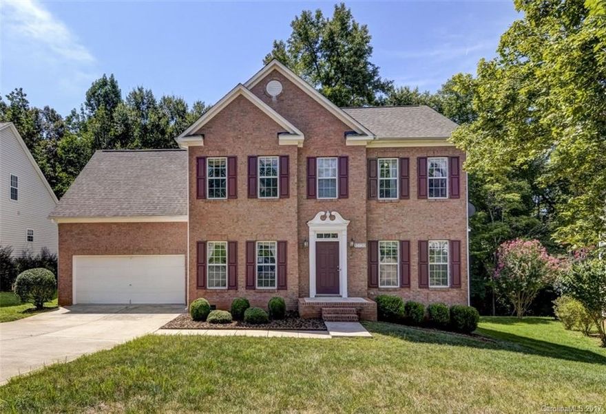 This stunning brick face home is one of Cardinal Woods finest. Its cul-de-sac location is quiet and private yet close to Uptown,airport,and Ballantyne shopping and dining. Updates include new S/S Bosch appliances, tile floors and granite counters. Spacious family room with gas fireplace and view of wooded back yard. Upper level has 4 bd/2 full baths, laundry rm and maximum closet and storage space.