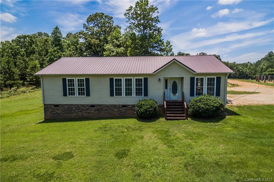 Come see this remodeled 3bedroom, 2 bath home with vaulted ceilings, an open concept, cozy fireplace, and large master bedroom, bathroom, and walk-in closet. Freshly painted with new floors and countertops in the kitchen and bathrooms! Enjoy the serene setting with 5 beautiful acres surrounding you!  Perfect for horses! Very low taxes!