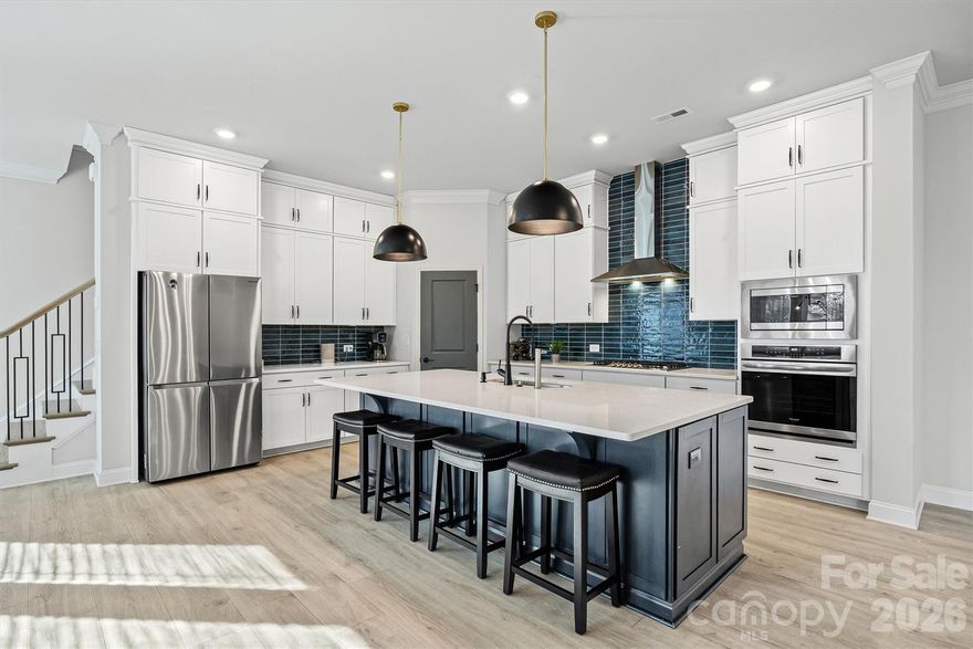 Welcome to 1245 Drummond Ave, a beautifully appointed townhome in the sought-after Villa Heights neighborhood! This inviting home offers an open, modern floor plan that flows seamlessly for everyday living and entertaining. The well-designed kitchen features white cabinetry, soft-close drawers, quartz countertops, a gas cooktop, stainless steel appliances and a spacious pantry — perfect for culinary enthusiasts and gatherings. The upper level includes a serene primary retreat, complete with a private balcony overlooking the expansive backyard oasis — a peaceful spot to relax and enjoy morning coffee or evening sunsets.

With 4 bedrooms and 3 bathrooms, this home combines generous space with thoughtful design. Enjoy the convenience of nearby amenities — shopping, dining and entertainment are just moments away, yet this home still offers a sense of neighborhood charm. Villa Heights is known for its walkability and community feel, placing you close to all that Charlotte has to offer. Don’t miss the opportunity to make this exceptional home yours!