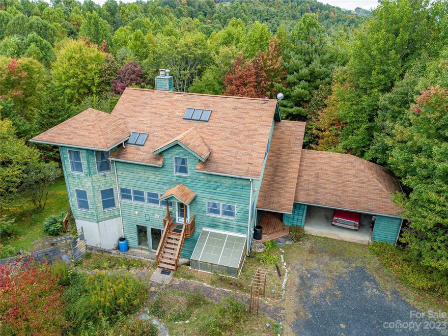 Superb craftsmanship and quality in a custom built home awaits you on this private 20 acre unrestricted estate. The possibilities are endless with 3 bedrooms, 2 offices, and basement there is plenty of room for a home based business etc. The living room has cathedral T&G ceiling, beautiful oak floors and floor to ceiling fireplace. This home has unique custom features such as a foundation to 2nd story octagon bay bump out giving each level a special addition. The basement has canning storage in the bay addition, main floor bay is dinning, and 2nd story bay gives a nice large relaxing area in master bedroom.  There is a two car garage. The large covered back porch is great for taking in the views and afternoon breezes. The grounds have remained organically grown for the past 25 years. An attached greenhouse.  There are a variety of tree trees on the property and more land could be cleared for additional farming or open up the gorgeous view.