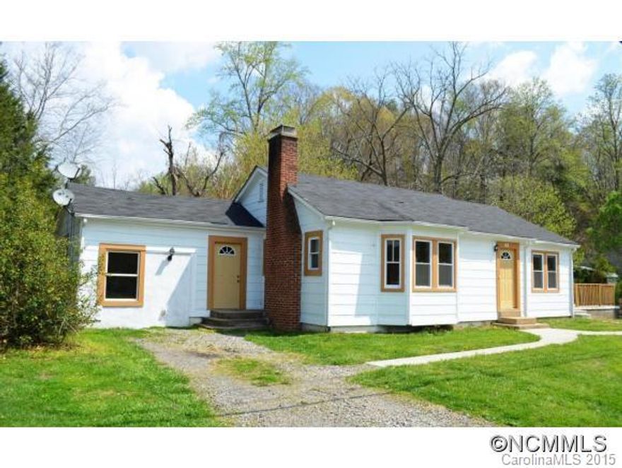 Cute 3 bedroom home in Swannanoa with side patio, creek, basement workshop, 2 driveways, corner lot, hardwood floors, baywindow in the living room, fireplace, and large back yard. Home sits on a level lot with garden space. Home Warranty Included. (Tenants are leasing the home on a month to month basis. Property is partially located in flood zone)