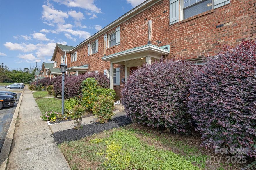 Well-maintained townhome in a fantastic location, just a stroll away from Plaza Midwood! Convenient access to interstates ensures a quick commute to Uptown and surrounding areas. The kitchen boasts updated countertops and cabinets. The exposed brick walls enhances the living room, guest, and primary bedroom. There's a private patio in the back, perfect for entertaining! HOA fees include trash pick-up and water. Flood insurance is covered under the HOA master policy. Check it out today!