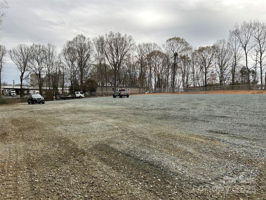 This lot is zoned Highway Corridor Mixed Use. County water and individual septic for the 2 mobile homes. The mobile homes are in need of work or buyer can have them removed to expand the parking lot. Currently 1.25 acre has been graded, graveled, and fenced. Fence is currently manual with cantilever but can be converted to remote. Mobile homes are aprox 1,000 sq ft 2 bed 2 bath from 1985. In the attachments you will see what is approved for use per the town of Wingate either allowed by right or with supplement requirements. Buyer must go through a commercial site plan review and approval process to make sure they comply with the other 333 pages of the Wingate Land Use Ordinance. Seller is willing to assist with this process once under contract. Please reach out to listing agent with any questions.