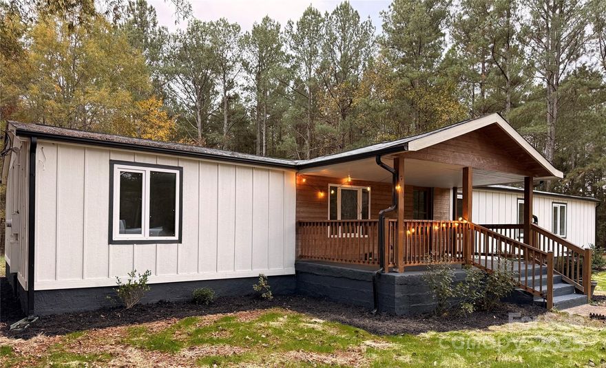 This fully remodeled former double-wide sits on a spacious one and a half acre lot, ready to become your home. Located on a quiet street in the northeast part of Lancaster County, just a few miles from the North Carolina border, this property offers peace and convenience. Renovations include new European windows, insulation, drywall, kitchen, electrical, plumbing, HVAC system, rear porch, fresh paint, and updated bathroom fixtures. It's close to Lancaster, Waxhaw, Monroe, and Cane Creek Park. The sale includes three parcels, with the second and third  being the buildable lots.