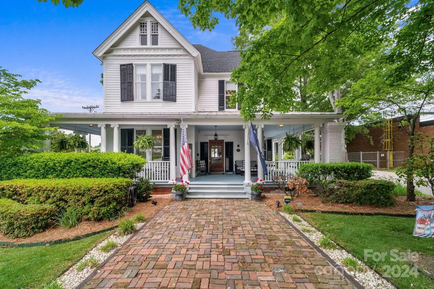 Step back in time when you enter this stunning, fully remodeled Victorian home built in 1899. It is listed on the National Registry of Historic Places and has beautiful, original pine floors throughout (that have been professionally restored), exquisite woodwork and 6 impressive fireplaces and mantles unique to each room. The updated kitchen boasts new double ovens, a custom wood range hood, a new gas range, a KitchenAid microwave drawer, freshly painted cabinets with gold finishes, and a large island. Other improvements include the repainted porch, NEW HVAC units, a newer roof, updated bathrooms, updated plumbing and electrical, fresh vapor barrier and insulation, and fresh paint inside. This historic home has soaring 12 foot ceilings with striking chandeliers and light fixtures throughout. The large detached two-car garage includes a spacious room over it that could be easily finished. This is a perfect home for entertaining! Don’t miss out on this once in a lifetime timeless beauty.