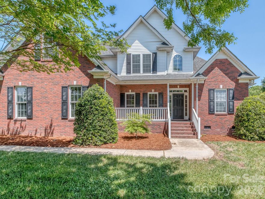 Beautiful FULL Brick...Primary Down 2 Story home...on over 2 Acres!!!  Incredible opportunity to live in the highly desirable Fairview Area.  Nice long driveway to your private estate.  Full brick, sideloaded 2 car garage, rocking chair front porch....Upon entering you notice the large Dining Room for those meals with loved ones.  Dramatic 2 Story Family Room with gas fireplace.  Well appointed kitchen with stainless steel appliances and pull up seating bar.  Primary Down with elevated tray ceiling....ensuite bath has garden tub, separate shower and double bowl vanity.  Large walk-in closet with built in closet shelving!  Upstairs you have 2 nice sized Bedrooms and full bath and a huge Bonus Room to enjoy.  Large laundry room on main level with tons of cabinetry and a sink. Overlook your kingdom on the huge screened porch!!  Low Union County Taxes.  This is a wonderful home in a great location to enjoy for may years.