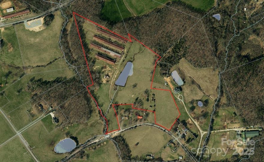 Welcome to an exceptional property offering endless possibilities on 33.9944 acres with picturesque views and a rolling topography. This unique tract is a ideal for equestrian enthusiasts, cattle farmers, or those seeking the perfect homestead or primary residence. The property consists of fenced pasture, a tranquil pond, creek, and scattered trees that provide shade to the landscape. The contour ensures easy navigation and full utilization of every acre. Several barns and poultry houses remain and are to be sold "as-is where is" and have potential to be restored and/or converted into storage or workspace. Don't miss out on this extraordinary chance to own a piece of North Carolina's beautiful countryside. A brick ranch home on 1.88 acres is also available for purchase.