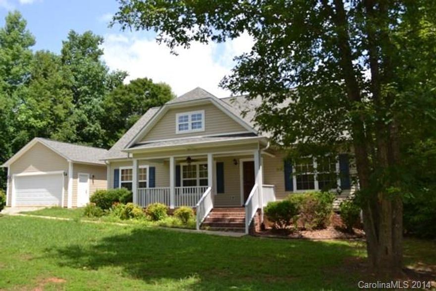 Country living, city close!  Great access to I-77!  This great home offers a split bedroom plan, vaulted great room with fireplace/gas logs.  Spacious kitchen and eating area.  Unfinished bonus room upstairs offers great potential for added square footage!  Detached double garage, large deck and rocking chair front porch!  All on 1 acre lot!