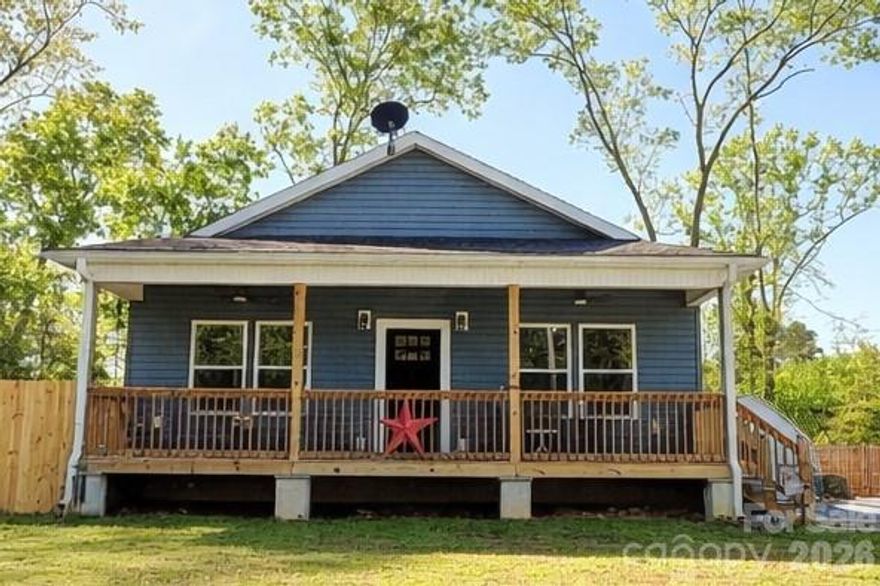 Welcome to easy lake living in the desirable Pinehaven Estates community at Badin Lake! Built in 2023, this beautifully crafted home offers the perfect blend of modern design, functionality, and low-maintenance living—ideal for a weekend retreat or full-time residence. The encapsulated crawl space adds an extra level of efficiency, moisture control, and long-term durability.

Originally designed as a 3-bedroom home, the current owner thoughtfully converted the third bedroom into an oversized walk-in closet, creating a spacious and luxurious storage solution. With an acceptable offer, the seller is willing to convert the space back to a true third bedroom—each bedroom complete with its own closet—offering flexibility to suit your needs.

Inside, you’ll find a bright and inviting layout highlighted by custom kitchen cabinetry, granite countertops, tile backsplash, under-cabinet lighting, and a large center island—perfect for cooking, gathering, and entertaining. The open living spaces flow seamlessly, creating a comfortable and functional environment for everyday living. Much of the furniture can convey with an acceptable offer, making this an easy, turnkey opportunity.

Step outside and enjoy the charming covered front porch—ideal for rocking chairs and relaxing evenings—or head to the side deck, perfectly positioned for grilling and outdoor dining. The fenced backyard provides privacy and space for pets or play, while two wired storage sheds offer excellent options for tools, hobbies, or additional storage. Spacious parking ensures room for guests, boats, or multiple vehicles.

Located within Pinehaven Estates, residents enjoy access to a community swimming area and boat ramp, with an optional HOA that keeps costs low while still offering great amenities.

Just moments from Badin Lake and close to Uwharrie National Forest—a popular destination for camping, hiking, horseback riding, and ATV/OHV trails—this property offers the best of outdoor living. Conveniently situated within approximately one hour of Charlotte, Greensboro, Winston-Salem, and Pinehurst, you’ll enjoy both privacy and accessibility.

Don’t miss this opportunity to own a nearly new home with built-in flexibility, thoughtful upgrades, and access to lake life at its best!