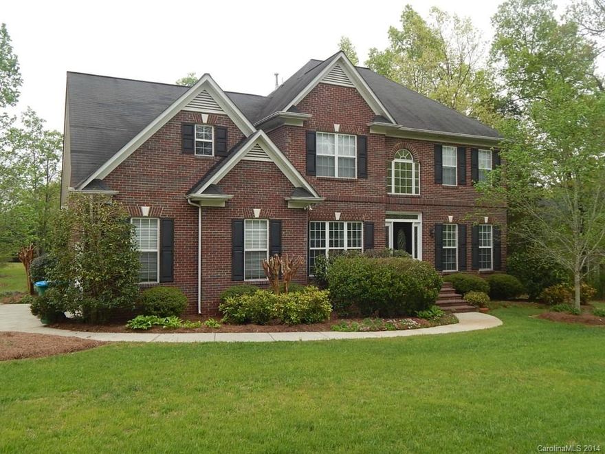 Gorgeous 2 sty full brick home on 1.12 acre wooded lot. Beautiful bamboo flooring, new carpet upstairs, new paint throughout. Open kit w/granite counters. BR & full BA on main. Huge MBR w/fp on 2nd floor as well as huge MBA & walk-in closet. 2 addt'l bdrms  & bonus rm, laundry rm upstairs. 2 car side load garage. Deck . One year home warranty.