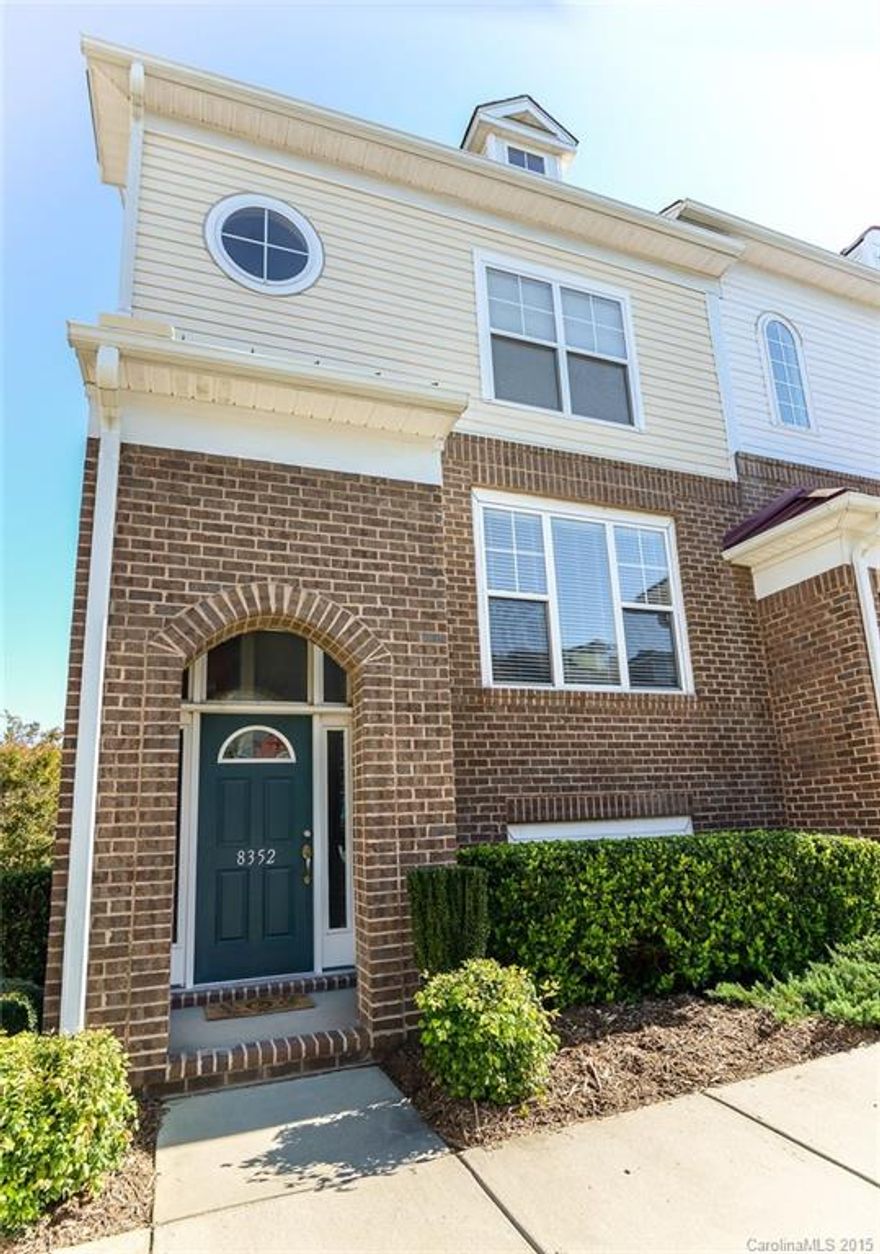 AWESOME three story townhome in the center of shopping, dining, and entertaining. Sought after End unit with two car garage. Bonus room/guest room on lower level. Large deck and over-sized great room ideal for entertaining. New gorgeous hardwood laminate on main floor. Stainless steel appliances including new kitchen sink. Three bedrooms upstairs and two full baths. Windows galore for lots of natural light. HOA scheduled to paint front door, pressure wash, and stain deck.