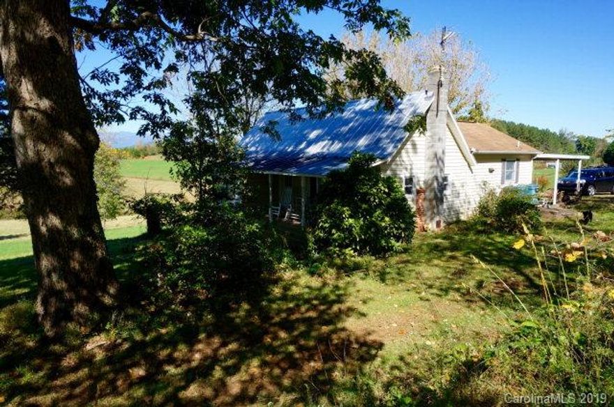 ON PASTORAL SITE ---- You could travel the world and find little to compare with this 1 Bedroom PLUS, 1 Bath ranch home in a picturesque, pastoral +/- 20 acre site. The rocking chair ready porch will be your quiet place to relax and enjoy the views. The open fields to the front of the home will provide many possibilities including pasture space or gardening. The home itself is remodeled and combines a rustic look with an open and bright floor plan. Interior highlights include the eat in kitchen and great room. The special feature is the 2nd level walk up attic that is not including the heated square footage total.  The home in move in ready and ready for you at $149,000.  Home inspection report available for review.