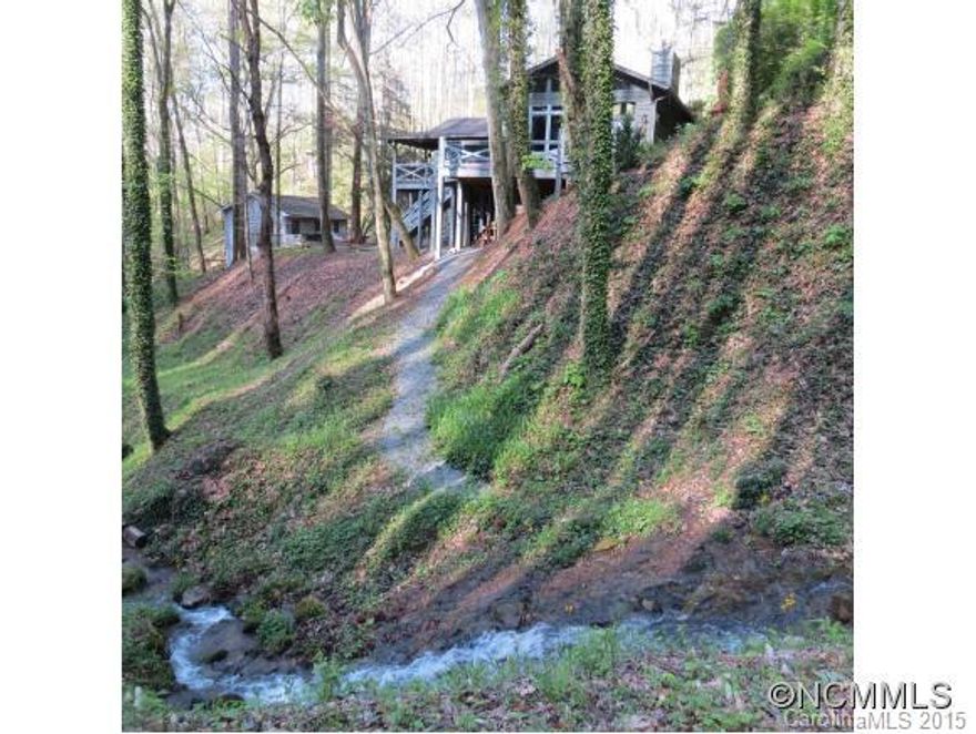 AWARD WINNING CABIN DESIGN -Cabin redmodel turn into Exquisite Mountain Retreat surrounded by a view of its 900Ft Waterfall Creek & Natural Mountain Terrain.Home is courted by the natural sunlight offered by the floor to ceiling windows & glass doors, 3 fireplaces, 2 family rms, butler pantry & more.Guest house sold furnished has its own utilities & style(square footage not included).This is a haven encapsulated on its first class renovations.